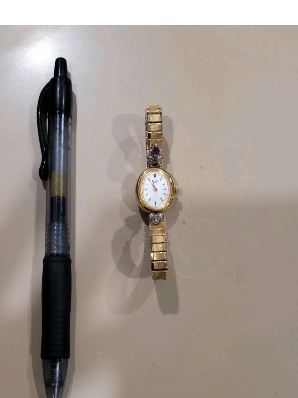 Vintage Pulsar Gold Tone Women's Watch with Purple Gem Accents